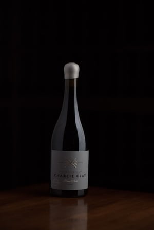 A bottle of Charlie Clay Pinot Noir