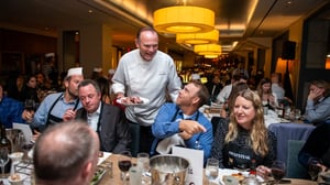 photo of Chef Charlie Palmer serving guests at The Beefsteak in Washington DC