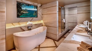 Photo of bathroom with tub and shower in the Ambassador Suite at Grand Sierra Resort in Reno, Nevada.