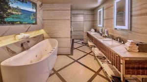 Photo of bathroom with tub and vanity in the Ambassador Suite at Grand Sierra Resort in Reno, Nevada.
