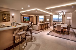 Photo of main room with bar, living and dining areas in the Diplomat Suite at Grand Sierra Resort in Reno, Nevada.