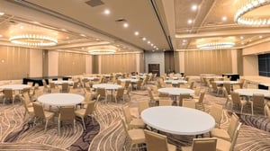 Photo of Crystal Ballroom at Grand Sierra Resort in Reno, Nevada, showing banquet setup and a stage