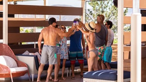 Friends enjoying time in a cabana at the GSR pool.